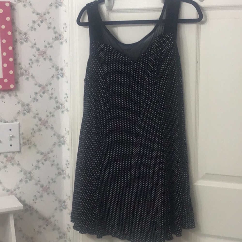 Plus size 26 W black w/ white polka dots swim suit. Length is 33”.